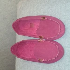 Fushia loafers with gold accessories.